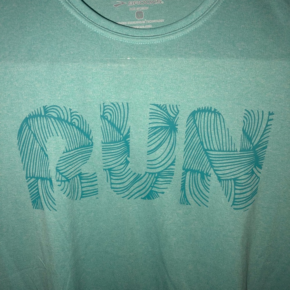 Never worn women’s Tiffany’s blue Brooks tech top